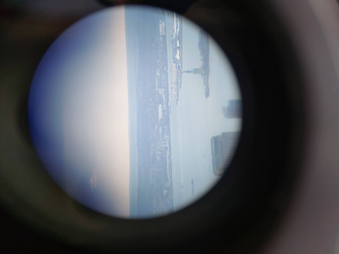 Statue of Liberty through binoculars