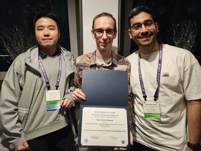 The SliceGuard team holding the MobiCom 2024 Best Demo Award certificate