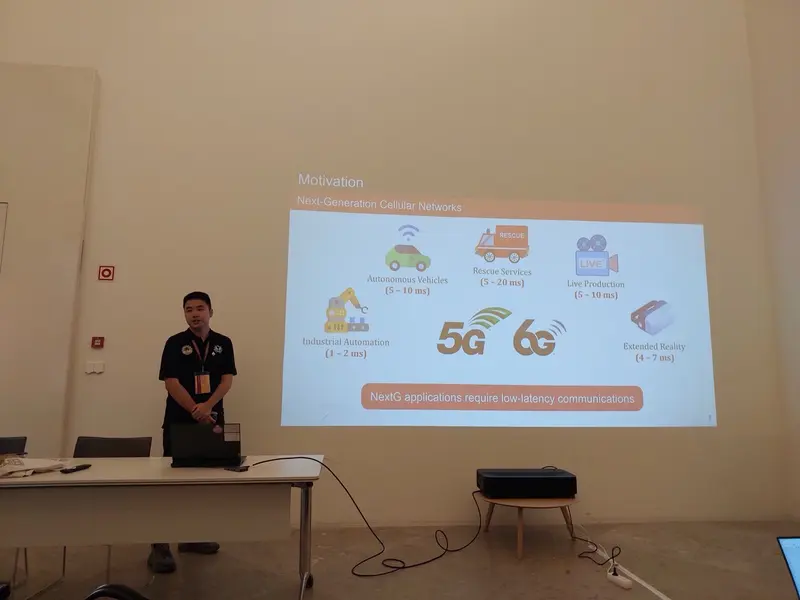 My colleague beside a projected slide on low-latency 5G and 6G applications