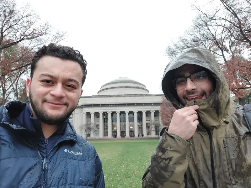 Selfie of two people in front of the MIT dome