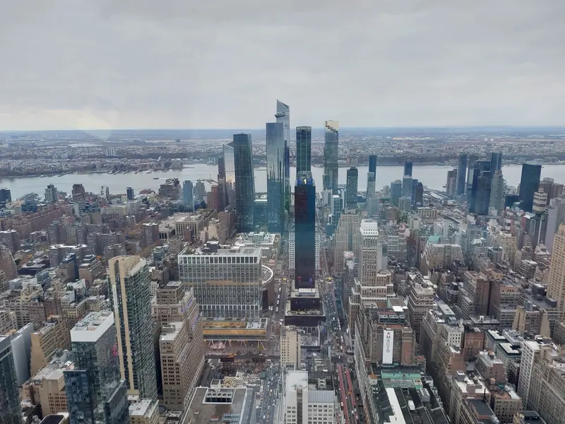 Manhattan's skyscrapers and the river beyond, seen from high above