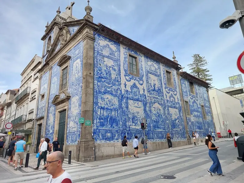 The chapel's blue-and-white tiled walls on a busy street corner
